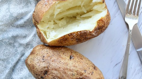 Baked Potato with a slice open showing the white insides