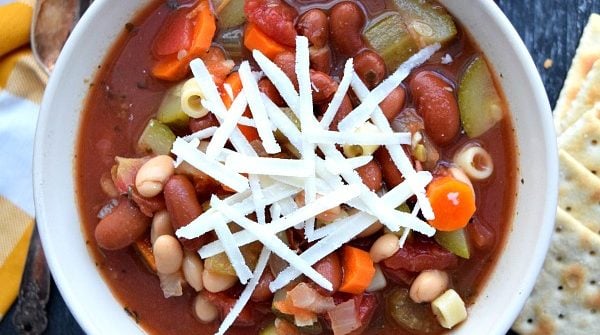 overhead shot of minestrone in a bowl with grated cheese