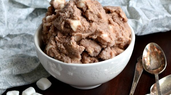 a small bowl of s'mores snow ice cream with marshmallows and spoons