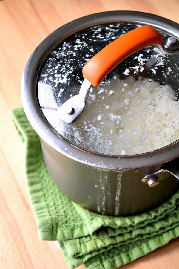 When cooking rice on the stovetop, should the lid be left on or