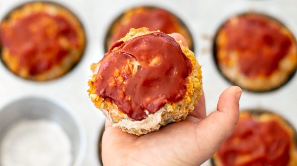 hand holding a turkey veggie meatloaf muffins