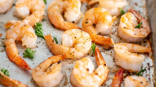 close up of oven baked shrimp recipe on a sheet pan