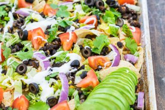 black bean nachos recipe on a sheet pan ready to eat