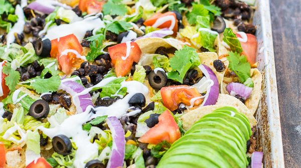 black bean nachos recipe on a sheet pan ready to eat