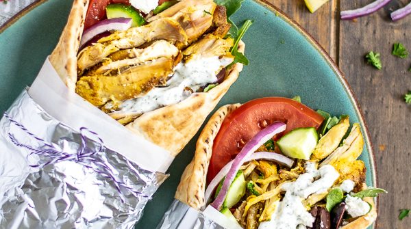 two chicken shawarma wraps on a plate