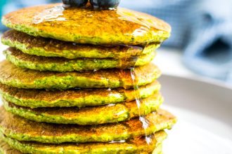 close picture of a stack of green oatmeal packs with syrup drizzling down the side