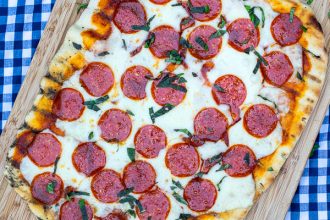 overhead photo of a whole pepperoni grilled pizza