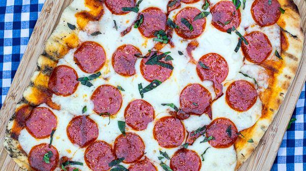 overhead photo of a whole pepperoni grilled pizza