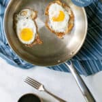 frying pan on a table top with towel