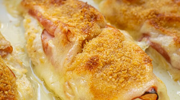 close up of a chicken cordon bleu baked chicken in a casserole dish