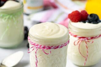 light and airy lemon whipped greek yogurt in a jar with a pink string