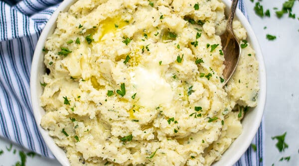 instant pot mashed potatoes for a crowd with melted butter and parsley