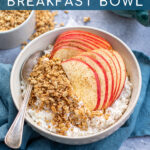 Pinterest Pin with text 'Apple Cinnamon Cottage Cheese Breakfast bowl', image of a bowl on a blue towel filled with cottage cheese, apple slices, and granola.