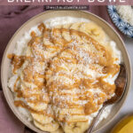Pinterest Pin with text overlay ' Peanut Butter & Banana Cottage Cheese Breakfast Bowl', image of bowl filled with cottage cheese, banana slices, and drizzled peanut butter.