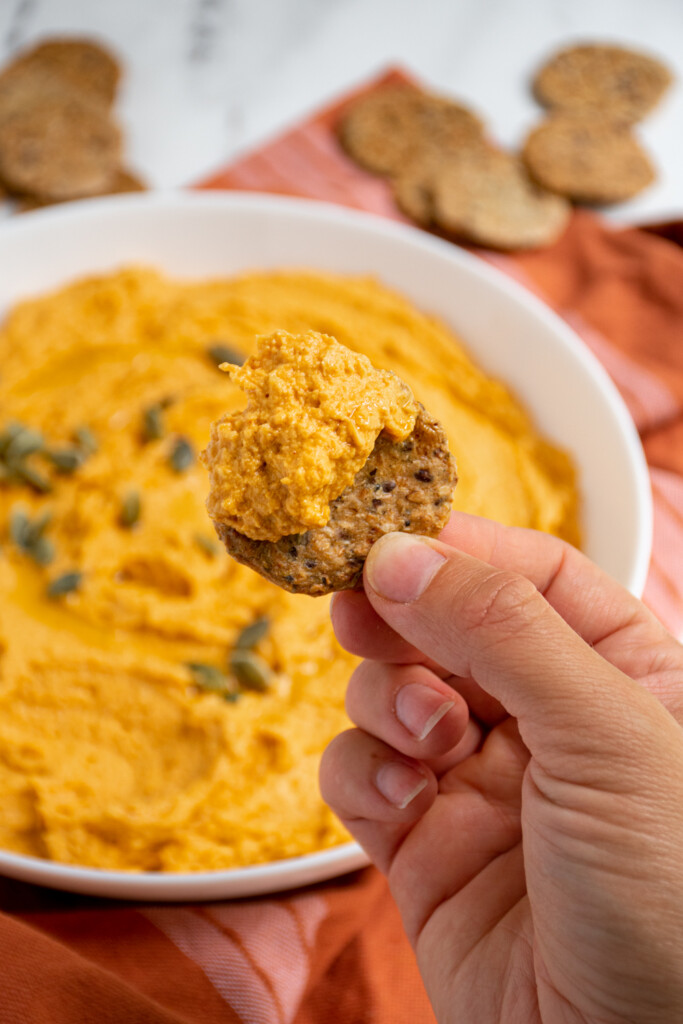 https://theschmidtywife.com/wp-content/uploads/2022/10/Cracker_Pumpkin_Hummus-683x1024.jpg