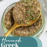 Pinterest Pin with text overlay "Homemade Greek Seasoning", image of a jar with a resting spoon full of greek seasoning.