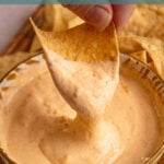 Pinterest pin with text overlay 'cottage cheese queso', image of a small yellow bowl surrounded by chips with cottage cheese queso.