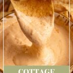 Pinterest pin with text overlay 'cottage cheese queso', image of a small yellow bowl surrounded by chips with cottage cheese queso.