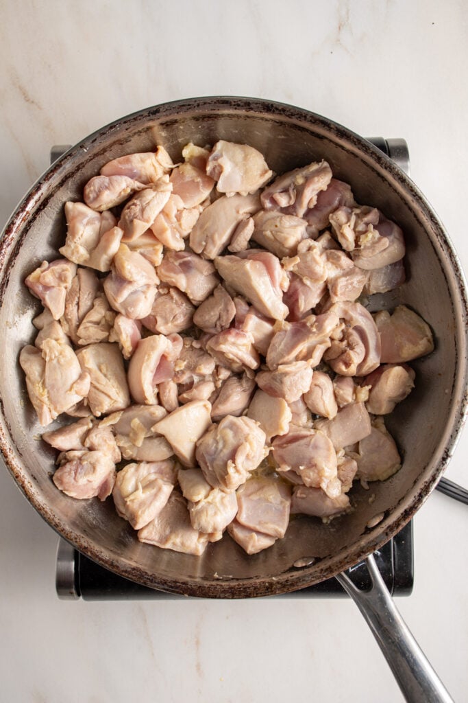 Cooked chicken in a skillet.
