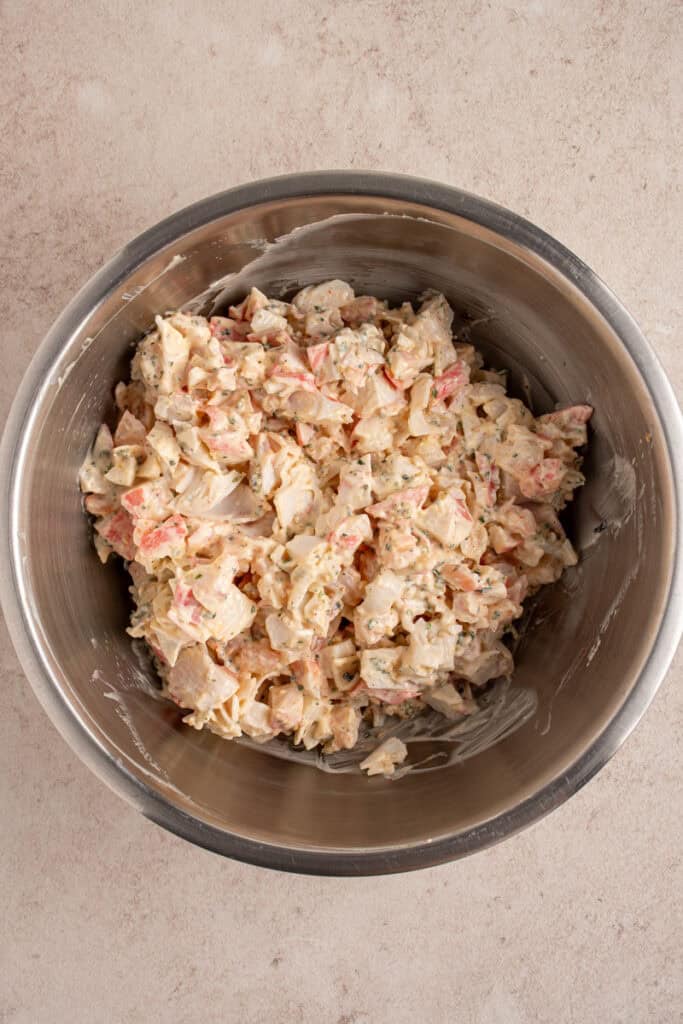 Crab and shrimp mixture in a mixing bowl.