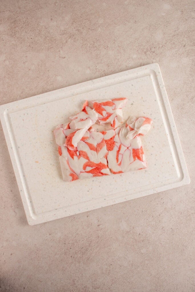 Imitation crab on a cutting board.