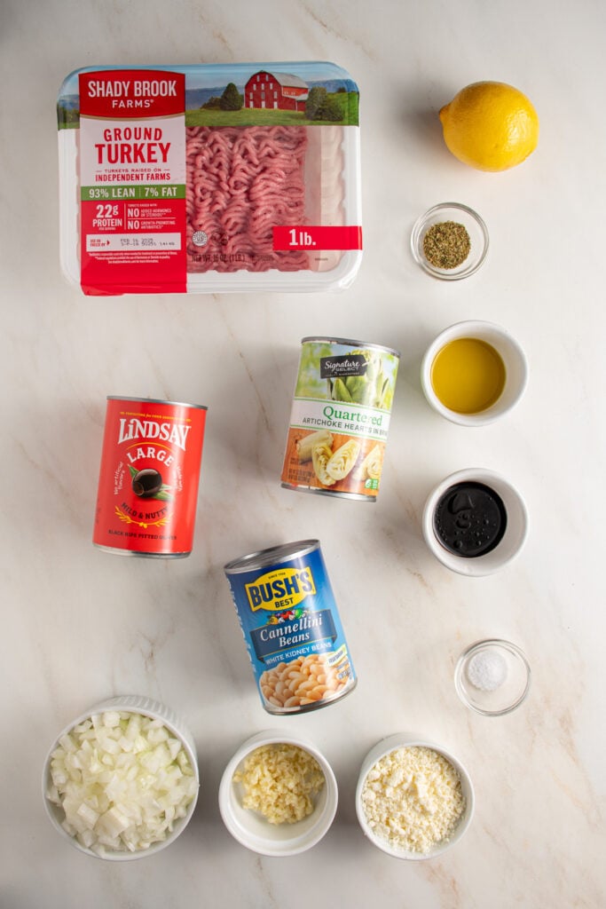 Ingredients for mediterranean turkey skillet laid out on a tabletop.