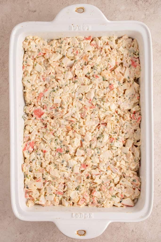 Spread crab and shrimp mixture over rice in the casserole dish.