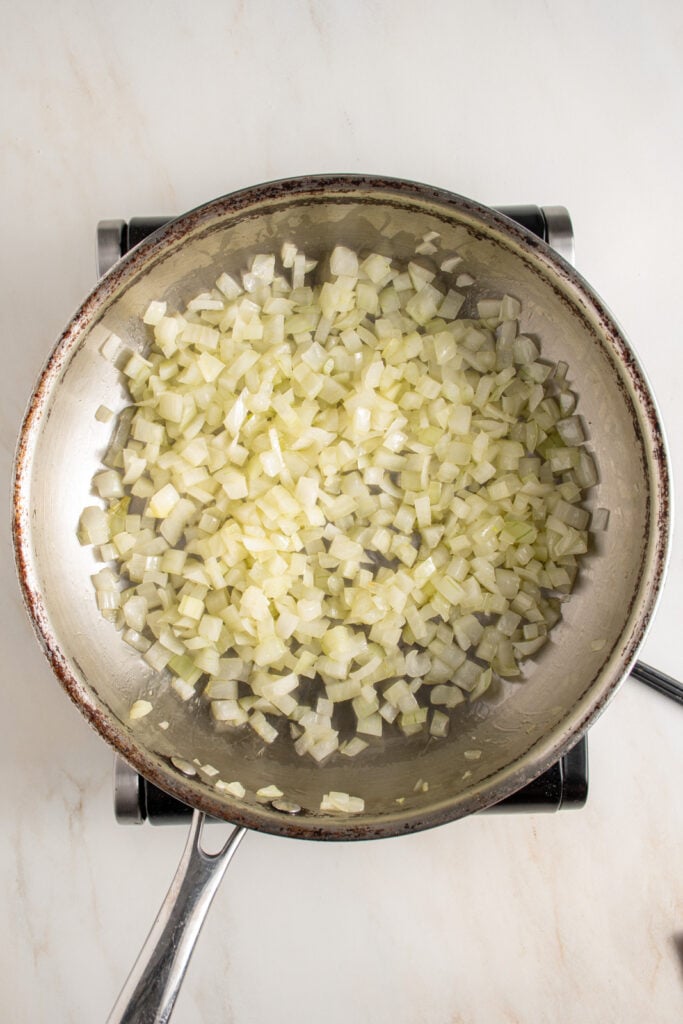 Cooked onions in a skillet.