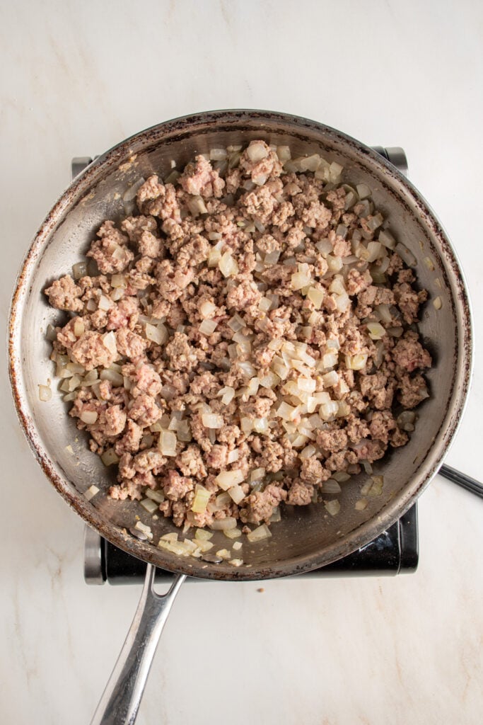 Cooked ground turkey in a skillet.