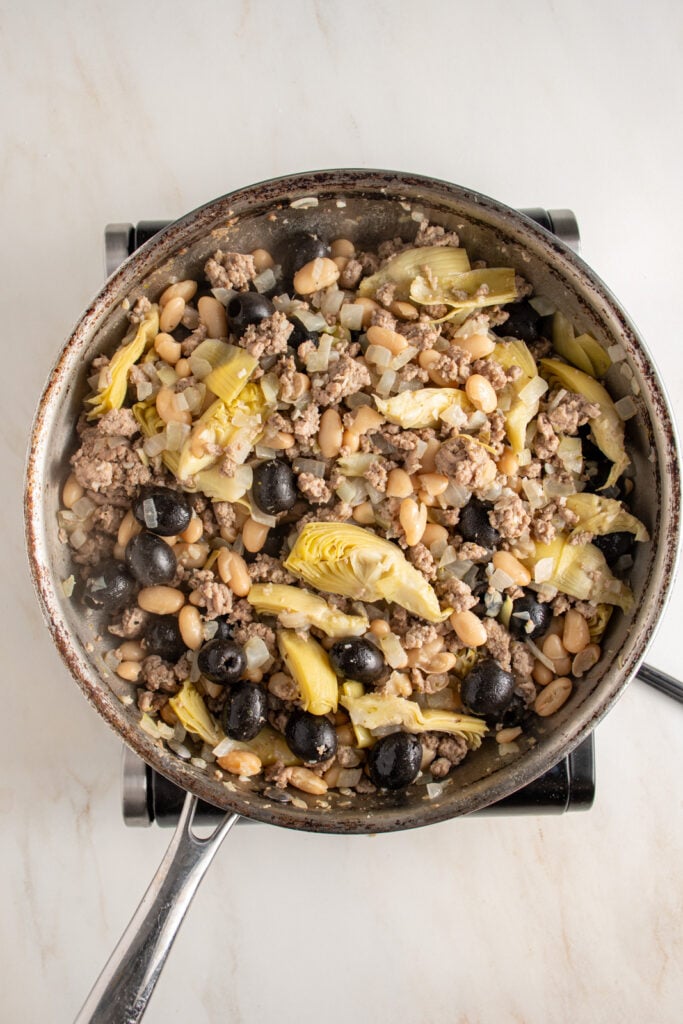 The mediterranean turkey skillet being cooked.