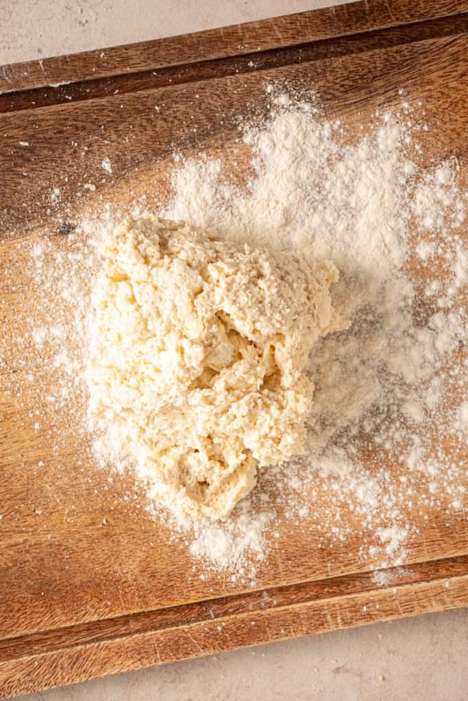 Biscuit dough on a cutting board.