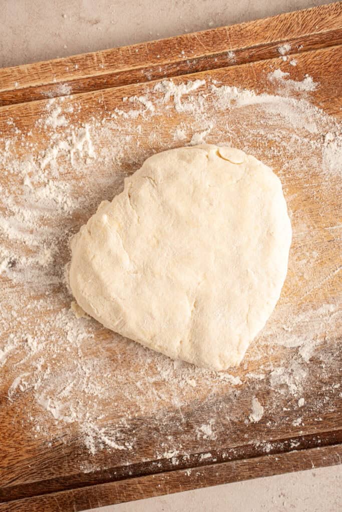 Biscuit dough prepped to be cut into pieces.