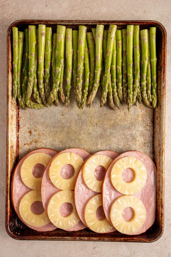 Asparagus added to the sheet pan with the ham.
