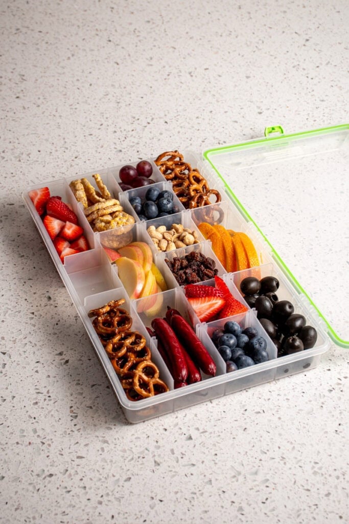 A snackle box filled with food.