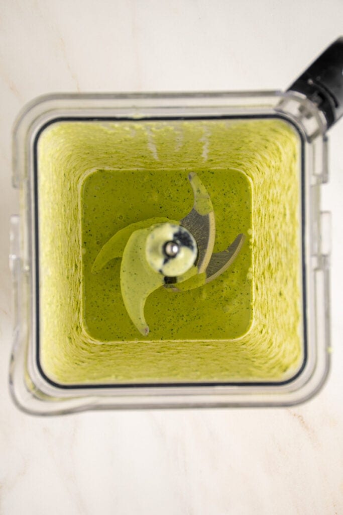 A blender with smooth green goddess dressing.