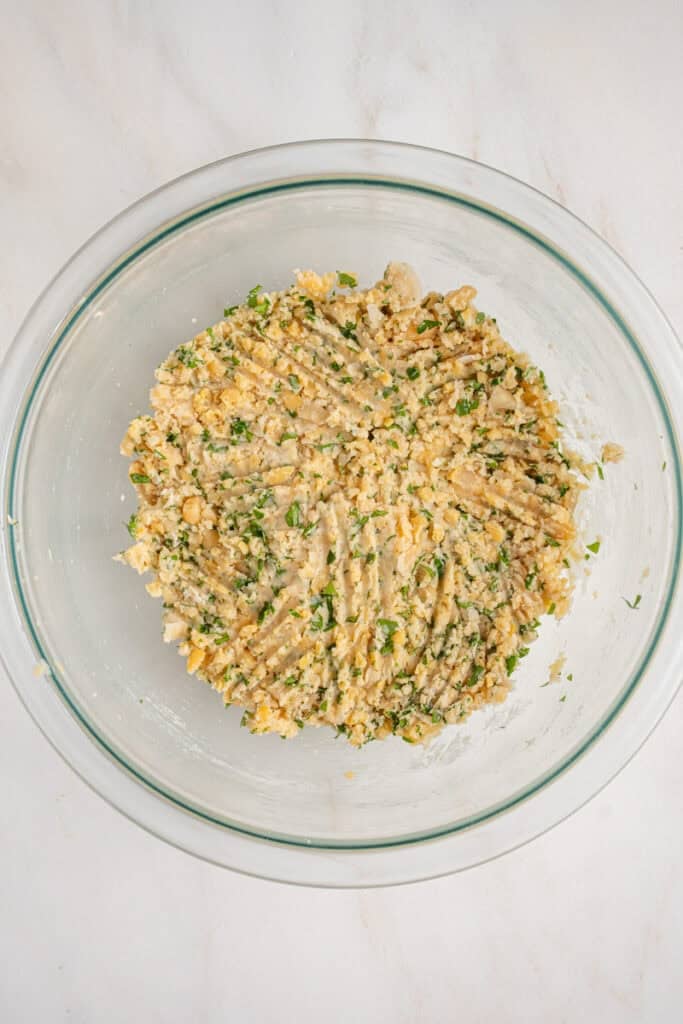 A bowl with chickpea fritter mash.