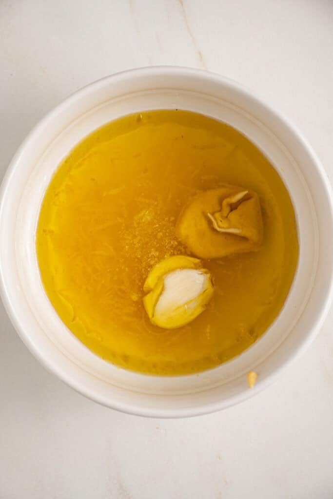 Ingredients to make the lemon dressing in a bowl.