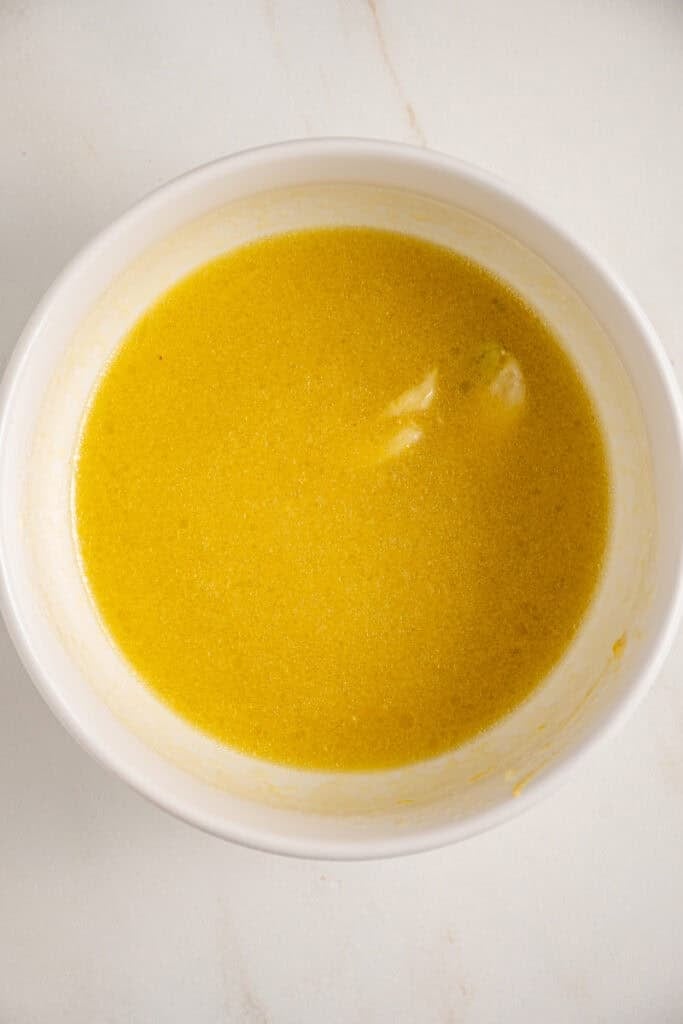 Lemon dressing all whisked together in a bowl.