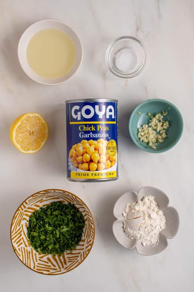 Ingredients laid out on a tabletop for chickpea fritters.