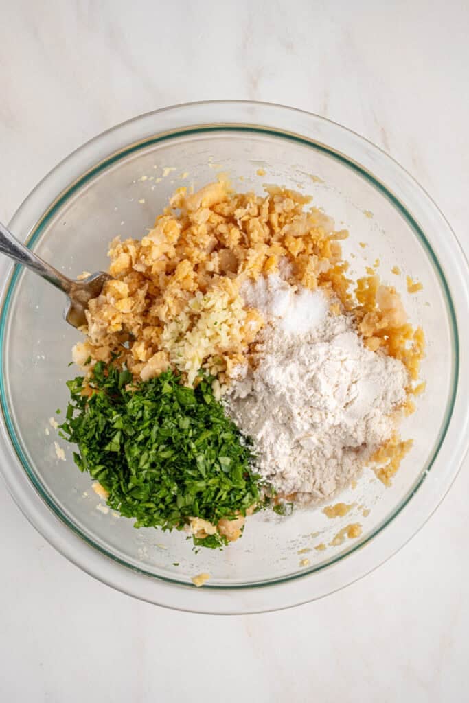 Ingredients in a bowl before mixing together to make the chickpea fritters.
