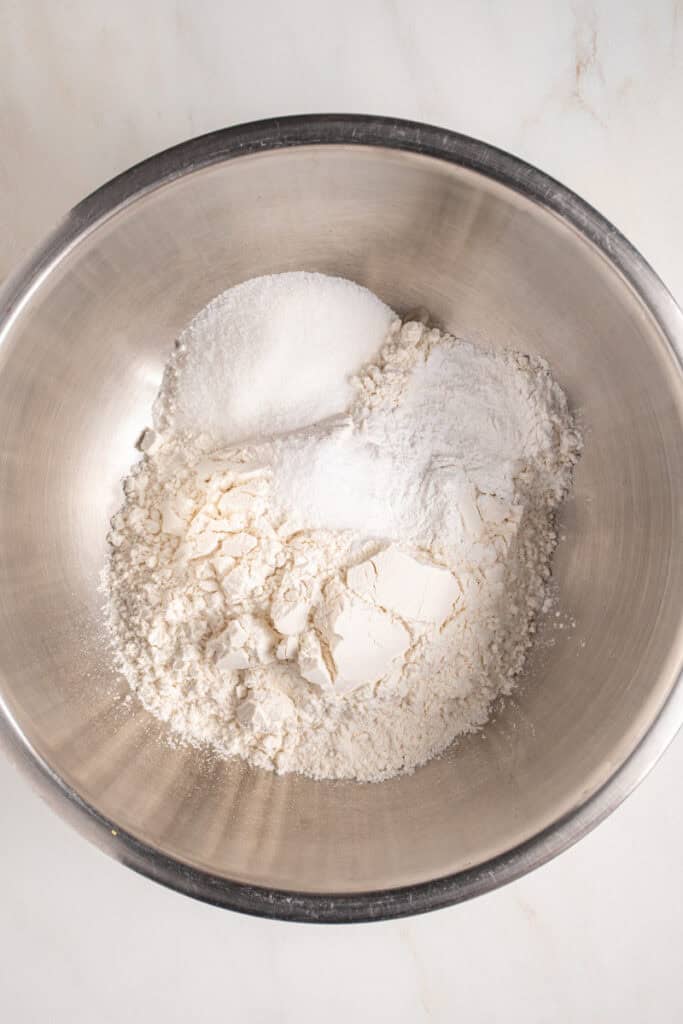 Dry ingredients in a mixing bowl for making pancakes.