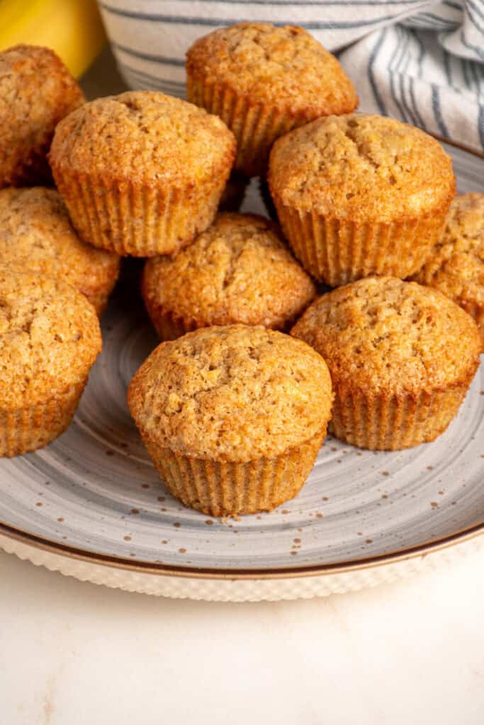 A plate full of whole wheat banana muffins.