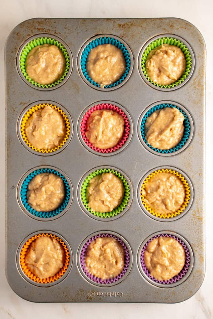A muffin tin of whole wheat banana muffin batter.