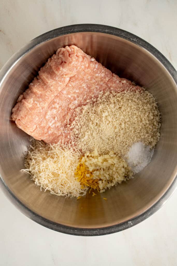 Ingredients in a bowl to make chicken piccata meatballs.