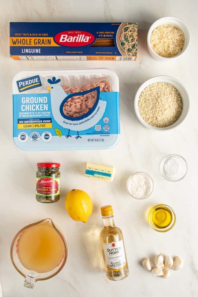 Ingredients laid out on a table top to make chicken piccata meatballs.