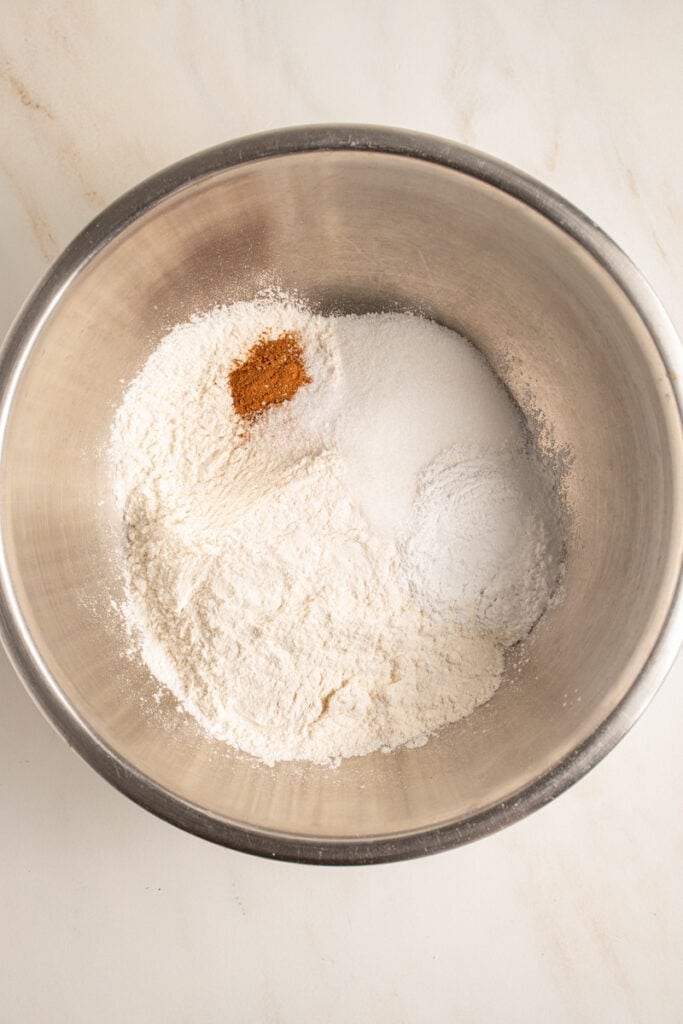 Dry ingredients all sitting in a mixing bowl.