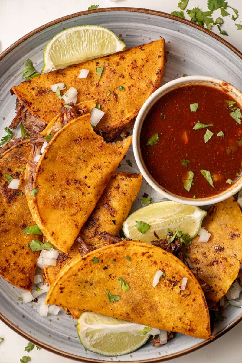 A plate of birria tacos made in the slow cooker.